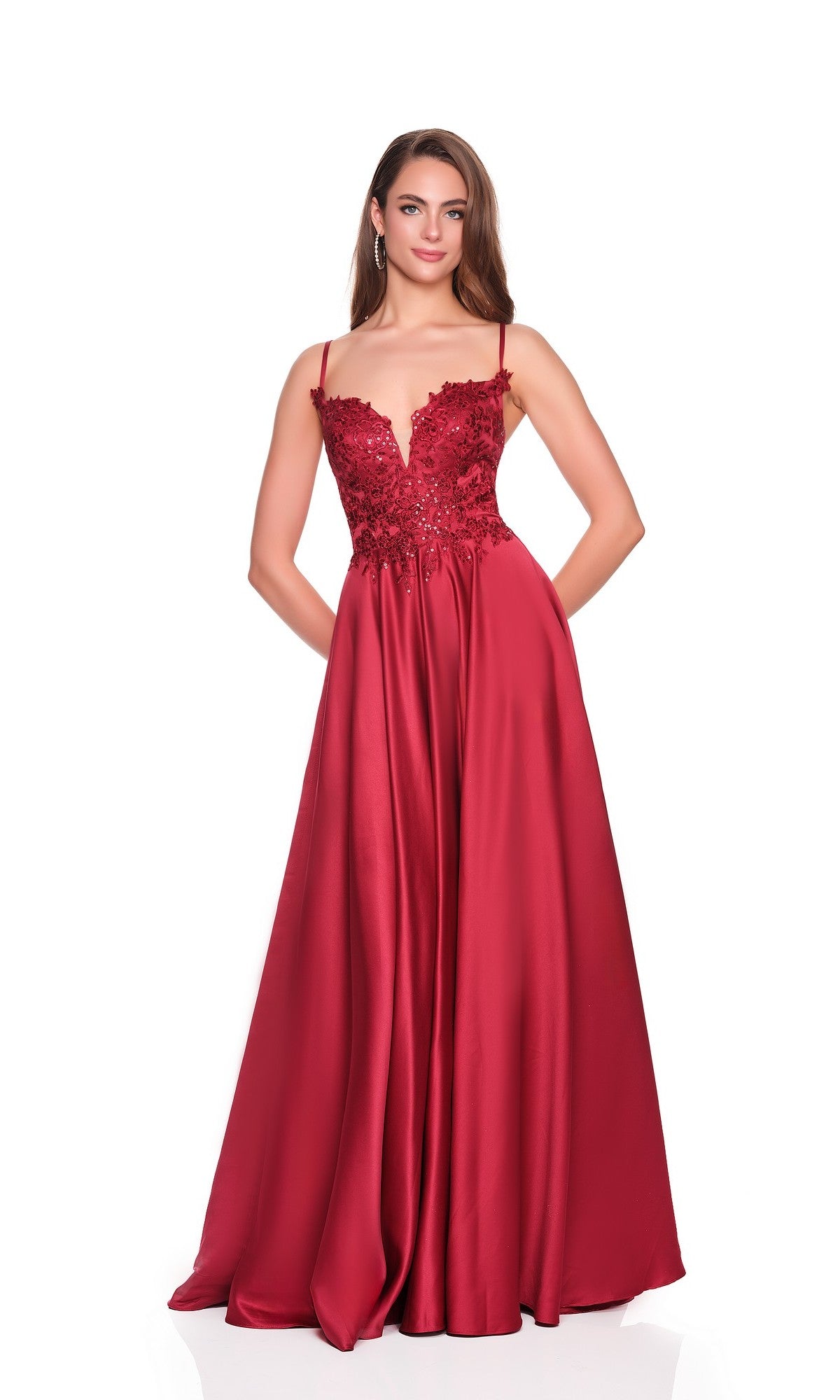 A woman poses against a white background wearing the Dave and Johnny 12873 long prom dress, featuring a floor-length satin skirt, sleeveless design, and embellished bodice in burgundy.